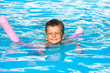 © Sergey Novikov - Happy small boy learns to swim with pool noodle