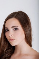 Close up portrait of beautiful young woman face. Isolated on whi