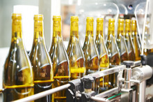 Bottling And Seaaling Conveyor Line At Winery Factory
