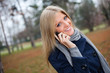 © djoronimo - Young woman talking on phone in park