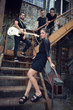 © Khorzhevska - Music band outdoor portrait. Musicians and woman soloist posing