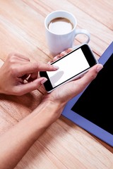 Poster - Businesswoman using her smartphone on desk