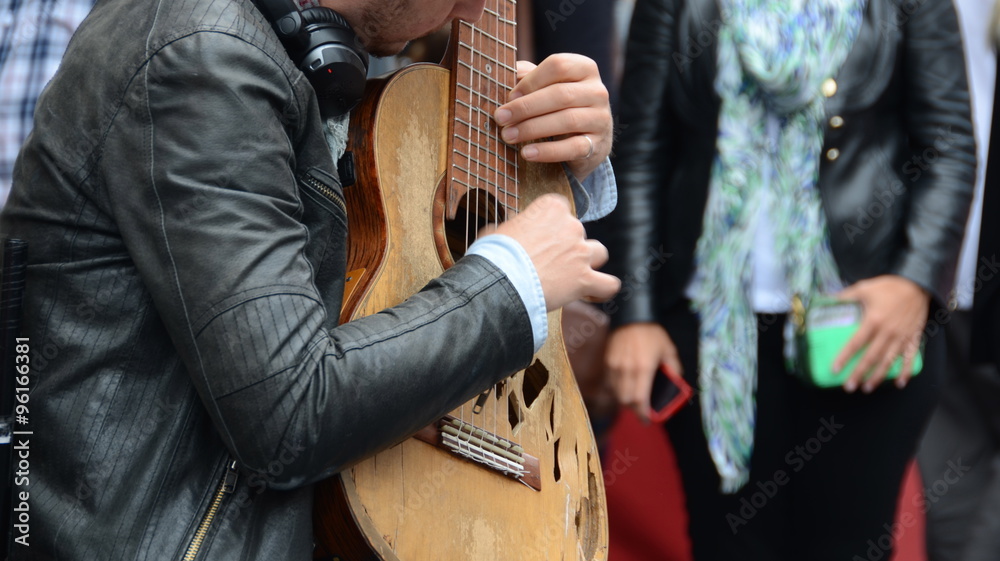Busker playing Spanish guitar