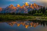 Fototapeta Natura - The dramatic colors of the Grand Teton Mountains reflecting in the water on a clear summer morning. 