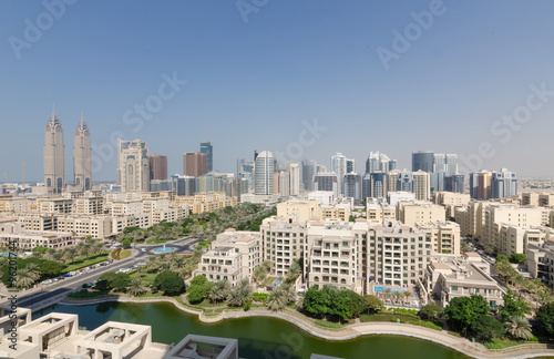 Naklejka na szybę dubai business towers, the greens, tecom living apartment complex in the daytime