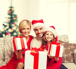 Poster - smiling family giving many gift boxes