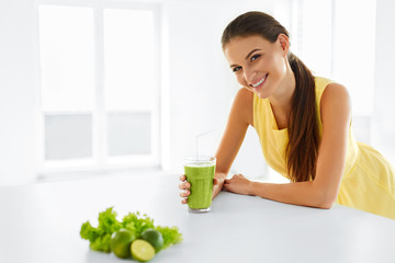 Healthy Meal. Happy Beautiful Smiling Woman Drinking Green Detox Vegetable Smoothie. Healthy Lifestyle, Food And Eating. Drink Juice. Diet, Health And Beauty Concept.