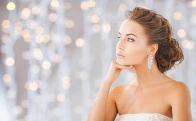 beautiful woman wearing shiny diamond earrings