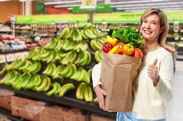 Sticker - Woman with grocery bag of vegetables.