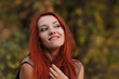 © pliekhova - Outdoors portrait of beautiful young woman with red hair