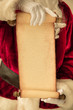 © Sunny studio - Santa Claus holding scroll paper blank