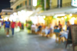Fototapeta Zachód słońca - abstract blurred restaurant or coffee shop on shopping street ba