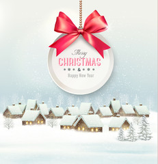 Holiday Christmas background with a village and  gift card with