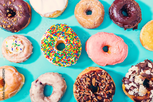 Cuadros en Lienzo Assorted donuts on pastel blue background