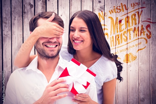 Fotografering Composite image of woman surprising boyfriend with gift