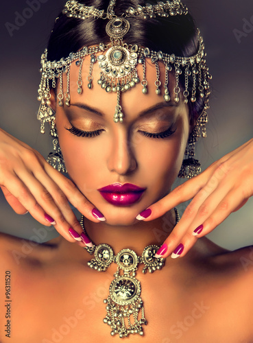 Obraz w ramie Beautiful Indian women portrait with jewelry. elegant Indian girl , bollywood style . Indian jewelry with dark skin model . Beautiful brunette asian girl with black veil on face 