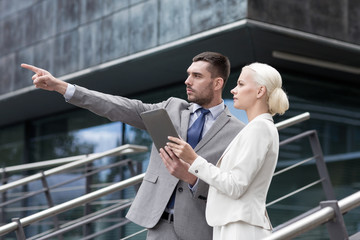 Sticker - serious businessmen with tablet pc outdoors