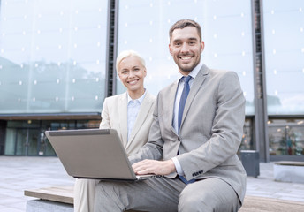 Sticker - smiling businesspeople with laptop outdoors