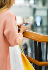 Sticker - close up of woman with smartphone and shopping bag