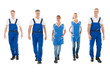 © Andrey Popov - Portrait Of Confident Janitors Walking In Row