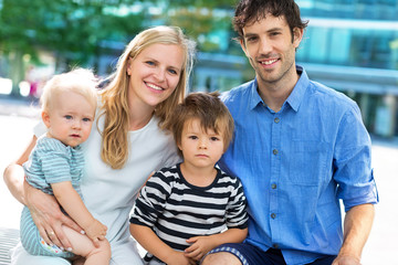 Wall Mural - Young family with two kids
