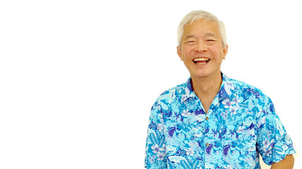 Wall Mural - Asian senior guy on blue hawaii shirt laughing on white isolate