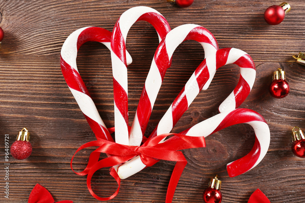 Christmas Candy Canes with Christmas decoration on table close-up