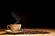 © amenic181 - Cup of coffee with smoke and coffee beans on old wooden background