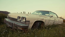 Old Abandoned American Vintage Car In A Field