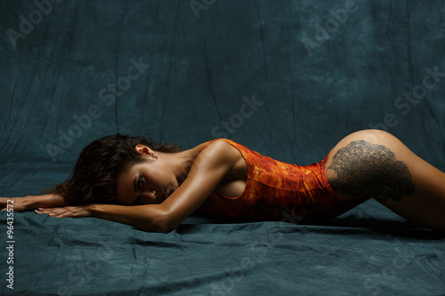 Fotografie, Obraz Shameless attractive girl with slim sexy figure lying on the floor