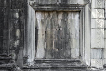 Wall Mural - window frame on stone wall of Angkor wat temple, world heritage,