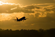 Silhouette plane take off in morning