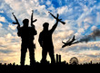 Silhouette of armed men and plane crashing into a city