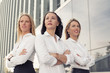 © Kaspars Grinvalds - Serious business women standing with their hands crossed