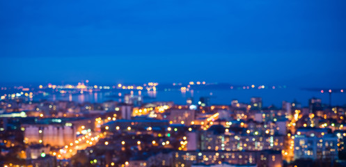 Wall Mural - defocused abstract city lights in the twilight with river, refle