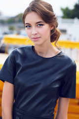 Wall Mural - young girl with dark hair in elegant dress,posing outdoor