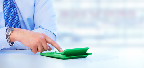 Aufkleber - Hand with a calculator.