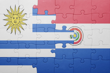 puzzle with the national flag of paraguay and uruguay