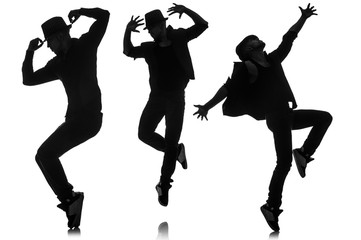 Wall Mural - Silhouettes of dancers in dancing concept