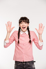 Poster - Amazed woman standing with raised hands up