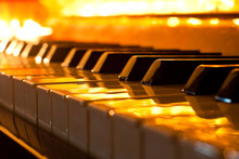 The Keyboard Of The Piano In The Golden Light