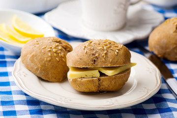 Wall Mural - rye buns with cheese for a breakfast