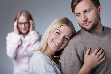 Wall Mural - Happy pair and overprotective mother