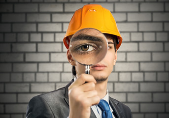 Construction man with magnifier