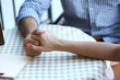 © Africa Studio - Loving couple holding hands on table in cafe