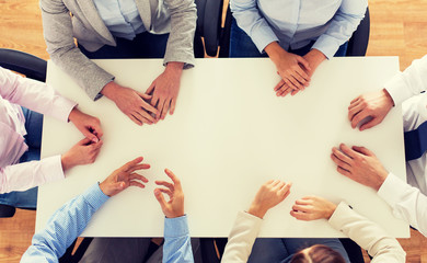 Poster - close up of business team sitting at table