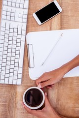 Poster - Businesswoman holding black coffee cup