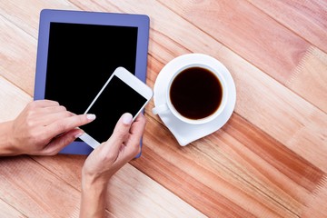 Poster - Businesswoman using her smartphone on desk