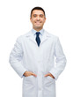 smiling male doctor in white coat