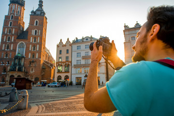 Wall Mural - Tourist photographing in the center of Krakow